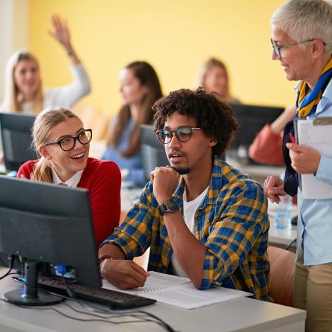 Teacher working with High School Student